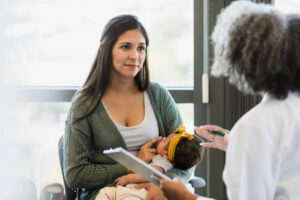 A new mum listening doctor's word