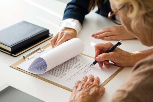 A Women signing the documents