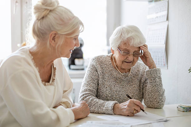 Old Women writing on papers