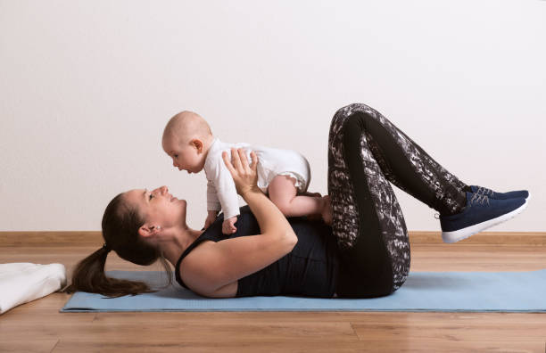 Mom Playing with baby during workout