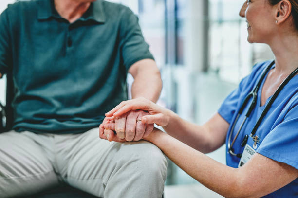 Healthcare worker comforting patient with a reassuring touch
